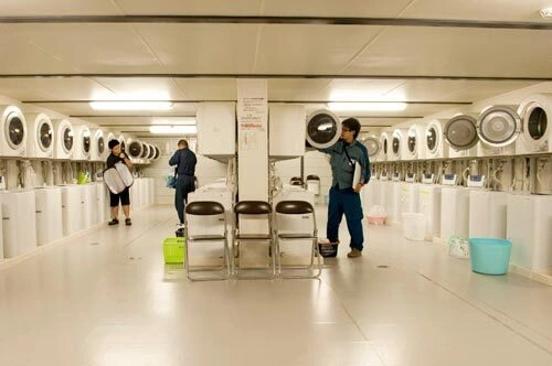 A laundromat has been set up for the workers who live temporarily at J-Village. Many of them are doing the work simply for the money, which can be about ¬100 per day. A laundromat has been set up for the workers who live temporarily at J-Village. Many of them are doing the work simply for the money, which can be about ¬100 per day.
