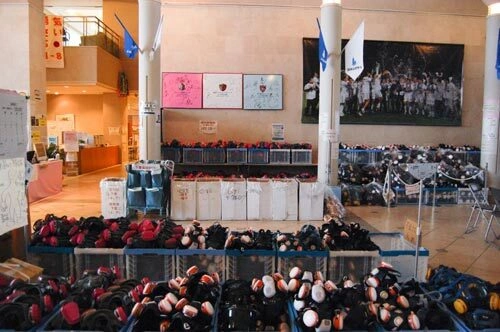 Cases of protective masks are stacked in the main building of J-Village. Cases of protective masks are stacked in the main building of J-Village.