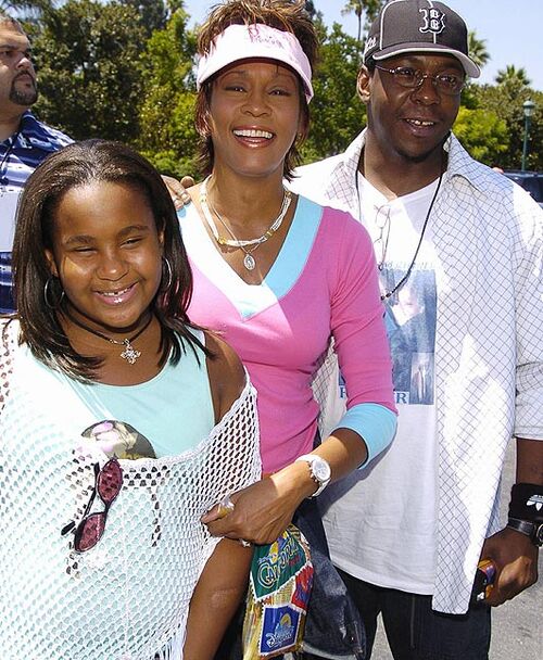 Whitney bên chồng cũ và con gái. Whitney bên chồng cũ và con gái.