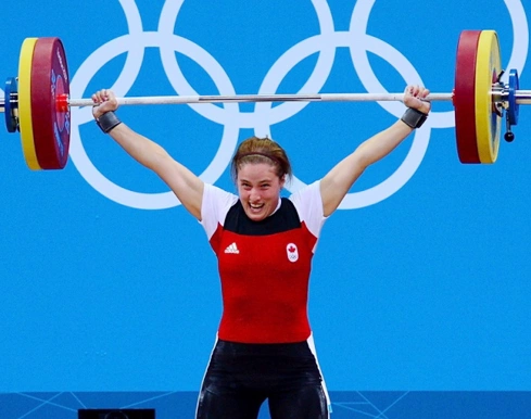 Lực sĩ người Canada Marie-Eve Beauchemin-Nadeau như thể nở nụ cười sau khi nâng tạ thành công. Lực sĩ người Canada Marie-Eve Beauchemin-Nadeau như thể nở nụ cười sau khi nâng tạ thành công.
