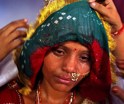 Sarita, left, 15, is seen covered in tears and sweat before she is sent to her new home in Rajasthan, India Sarita, left, 15, is seen covered in tears and sweat before she is sent to her new home in Rajasthan, India