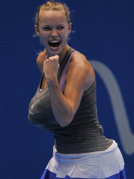 Wozniacki ăn mừng khi ghi điểm. Wozniacki ăn mừng khi ghi điểm.