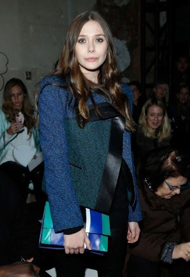 Elizabeth Olsen worked a blue and green blazer with leather lapels, at the Proenza Schouler show.
