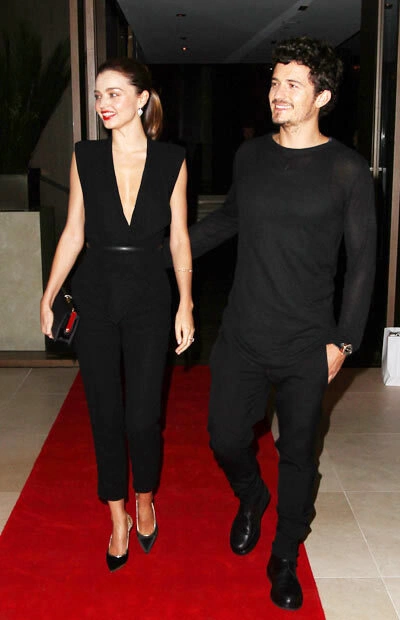 Miranda Kerr and husband Orlando Bloom pose together on the red carpet at the announcement of the Qantas and Emirates Partnership on Thursday (September 6) in Sydney, Australia. wearing a Carla Zampatti jumpsuit, Miranda Kerr and husband Orlando Bloom pose together on the red carpet at the announcement of the Qantas and Emirates Partnership on Thursday (September 6) in Sydney, Australia. wearing a Carla Zampatti jumpsuit,