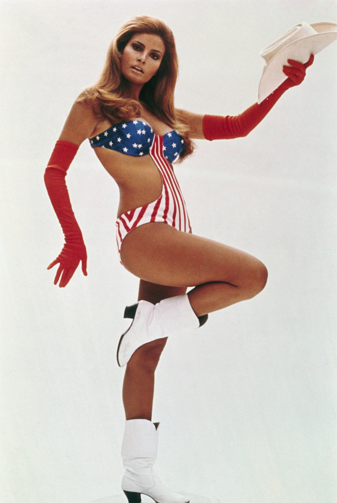 Tipping her hat in a patriotic swimsuit in 1970s Myra Breckinridge.