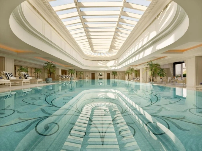 The features 235 rooms and suites, five restaurants and bars, a Peninsula Spa, an indoor swimming pool (pictured) and fitness center. Photo courtesy of Peninsula Shanghai Hotel